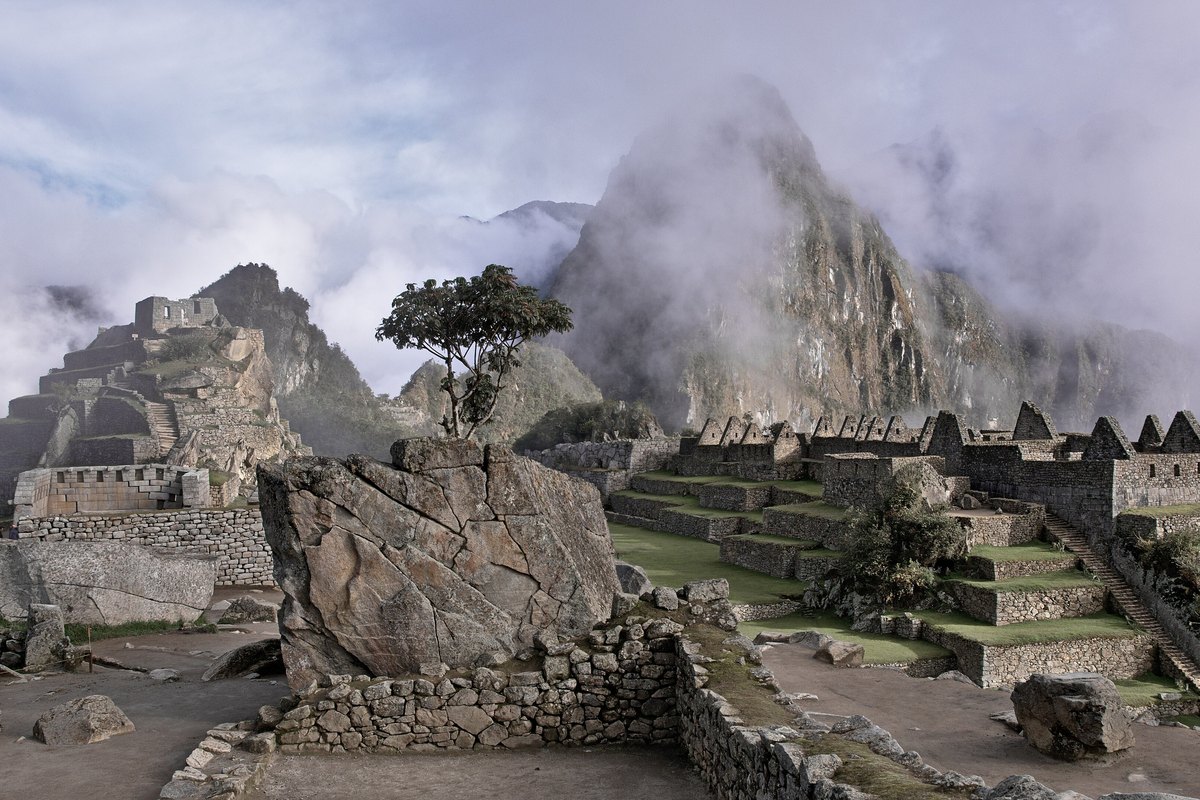 The ancient ruins of Machu Picchu shrouded in cloud-forest mist, Peru
